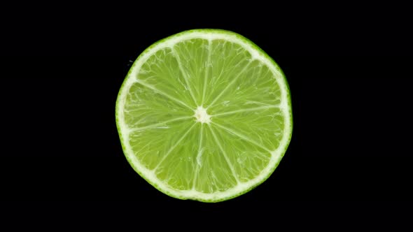 Lime citrus. Lime on black background, rotate. 4K UHD video