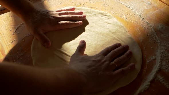 Master Chef of Italian Food Restaurant Form Pizza Dough By Kneading It in Flour