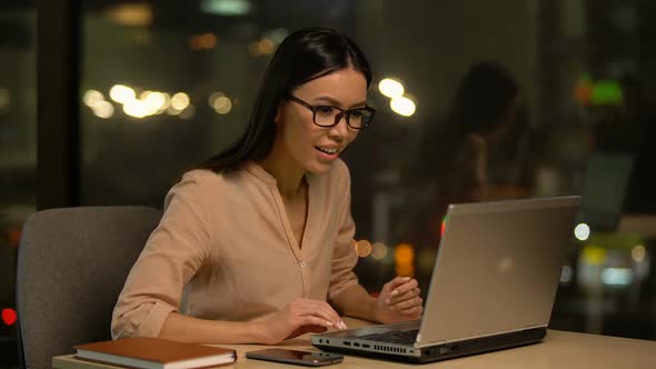 Girl Reading Great News From Laptop, Showing Yes Gesture, Successful Project