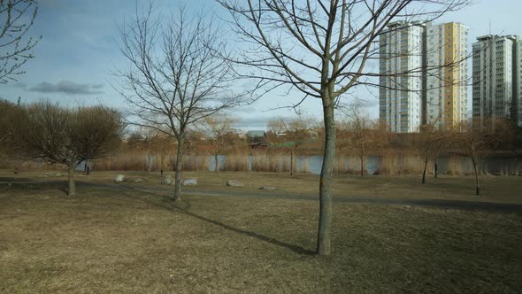 City block near the river. Multi-story houses. Water city system. Aerial photography.