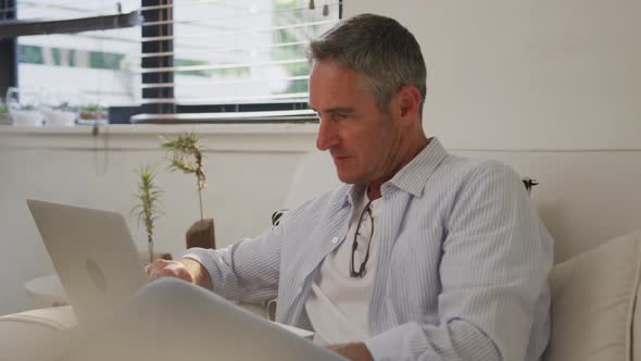 Man using laptop at home