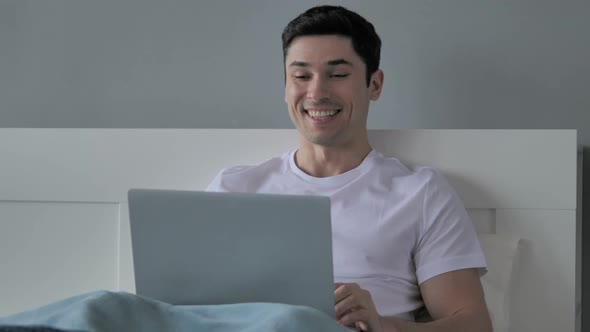 Online Video Chat on Laptop By Casual Young Man