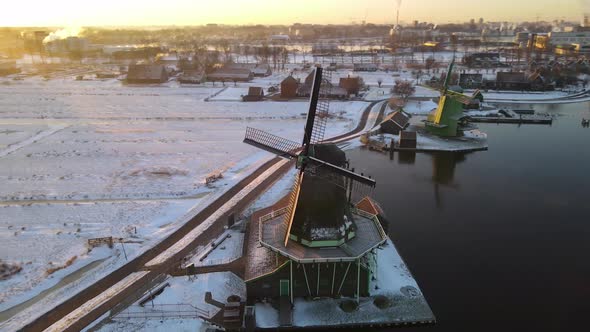 Zaanse Schans Windmill Village During Winter with Snowy Landscape Snow Covered Wooden Historical