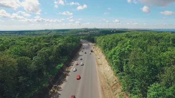 Aerial Landscape of Outskirts of Samara City, Roads, Forests, Beautiful Clouds, Silhouette of City