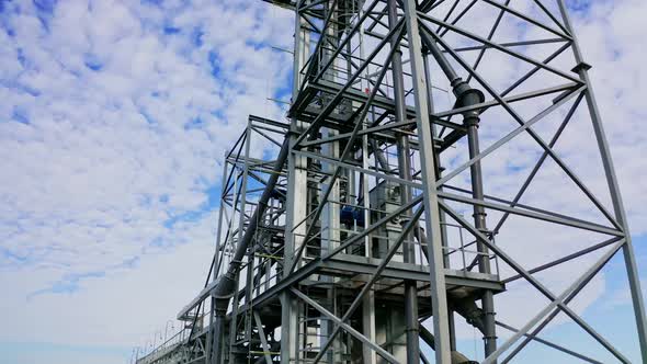 Facility frame construction. Industrial area in the countryside. Steel tower of a modern factory