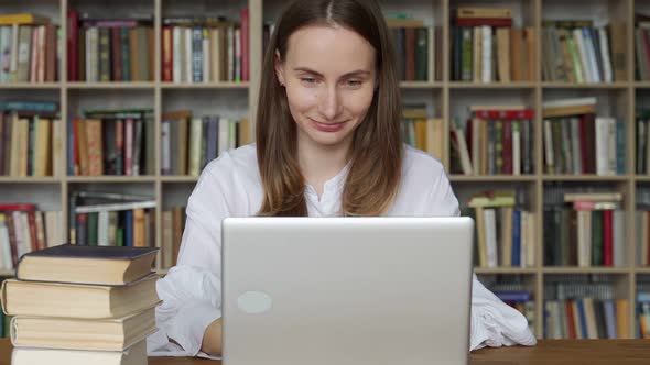 Woman Using Laptop and Learning Online