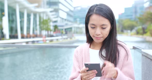 Woman Using Mobile Phone at Outdoor