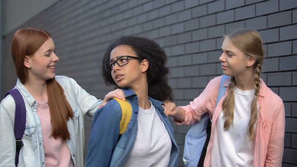 College Students Stopping Frightened Black Teenager in School Backyard, Bullying