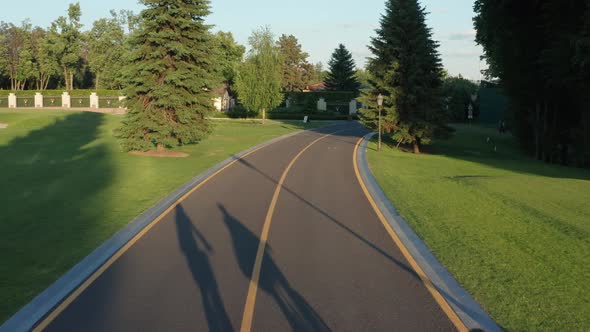 Aerial Shot of Lgbt Couple Biking on Bicycle Lane