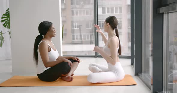 Multi Racial Girls Doing Yoga in Fitness Studio