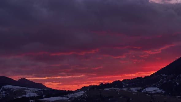 Beautiful twilight at sunset, red hellish clouds, fiery sky, from light to dark,