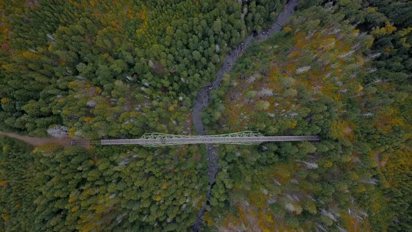Aerial top down view of an old and abandoned bridge in the middle of nowhere.