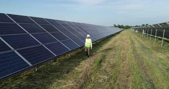 Solar Power Engineer Working on a Solar Farm