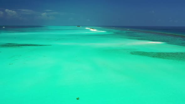 Aerial above panorama of exotic seashore beach voyage by blue ocean and white sand background of a d