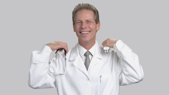 Glad Happy Middle Aged Man Wearing Stethoscope