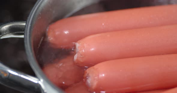 Sausages Boiled in a Saucepan with Air Bubbles and Hot Steam. 