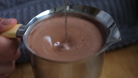 Blending Hot Chocolate in a Steel Pitcher. Comforting Food Concept