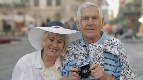 Senior Two Tourists Walking in Town Center. Traveling in Lviv, Ukraine