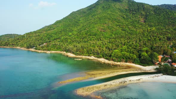 Thailand coast with hils and palm forest, small channel and emerald sea water