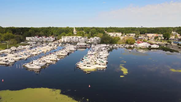 Drone flover of sailboats docked in a marina.