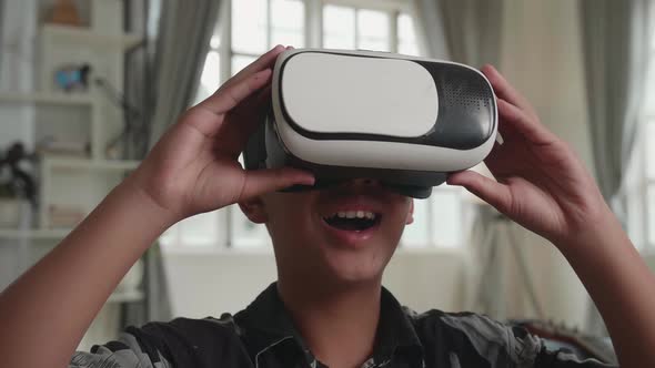 Close Up Asian Boy Explores Virtual Reality World