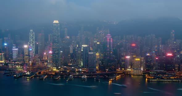 Day To Night Timelapse of Illuminated Hong Kong Skyline. Hong Kong, China