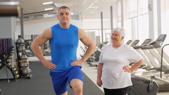 Pensioner Elderly Woman in a Gym on Step Platform