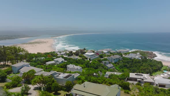 Slide and Pan Shot of Family Houses and Residencies Near Seaside