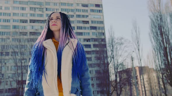 Stylish Woman in Trendy Outfit Standing on Street