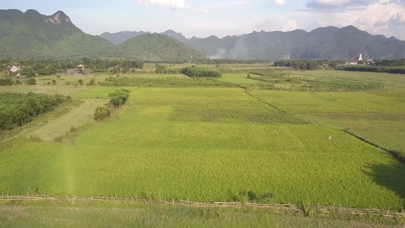 Motion Above Pictorial Wide Valley Covered with Green Fields