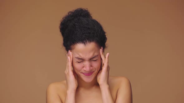 Beauty Portrait of Young African American Woman Suffering From Strong Headache