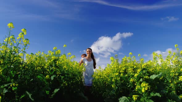 Romantic couple holding hands while walking in field