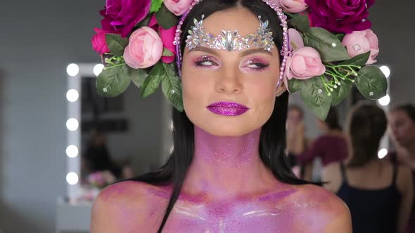 Woman with Flowers and Bright Makeup