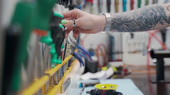 Female Mechanic with Tools at Workbench in Repair Service