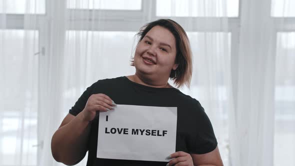 Concept Body Positivity a Fat Smiling Woman Holds a Sign with the Inscription I LOVE MYSELF Looking