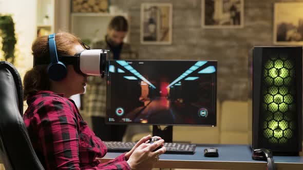 Professional Female Gamer Using Vr Headset and Wireless Controller