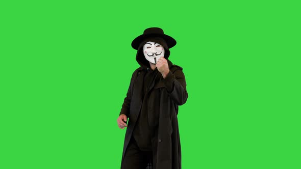 Anonymous Wearing Anonym Mask Calling you to Join Him on a Green Screen Chroma Key