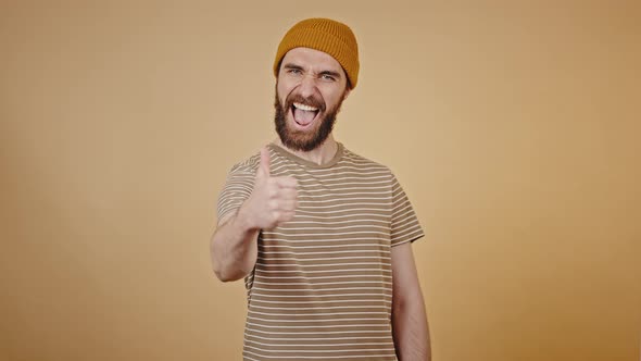 Middleaged Man Shows Thumbsup with Excitement Closeup