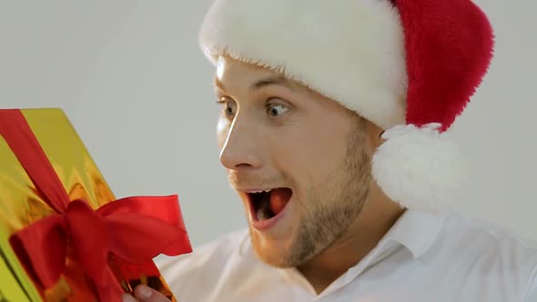 Santa Claus bodybuilder in Christmas looking at camera