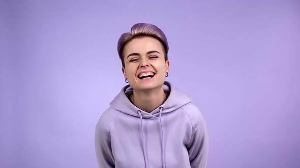 Woman Short Purple Hair Laughing Expressing Positive Emotion Indoors