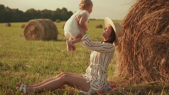 Mom holds the baby in her arms after