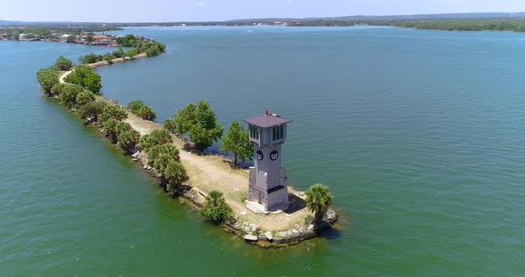 Aerial drone video of lighthouse on a peninsula near Horseshoe Bay, Texas.