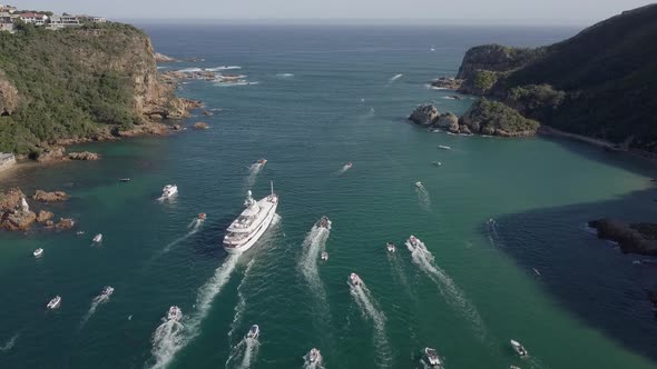 Yacht MV Katharine and local boats approach narrowest part of channel