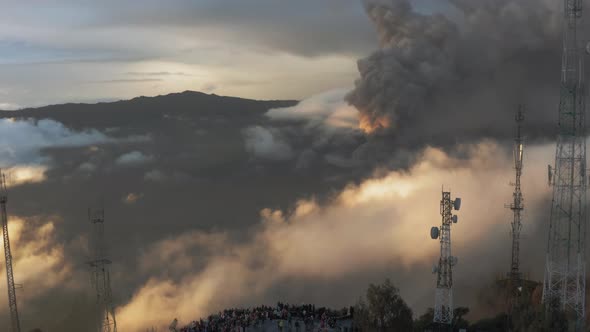 Drone Aerial View of Active Volcano Bromo. Sunrise, Crowd of Tourists on the Viewpoint.  Short.