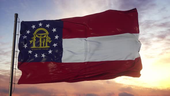 Flag of Georgia Waving in the Wind Against Deep Beautiful Sky at Sunset