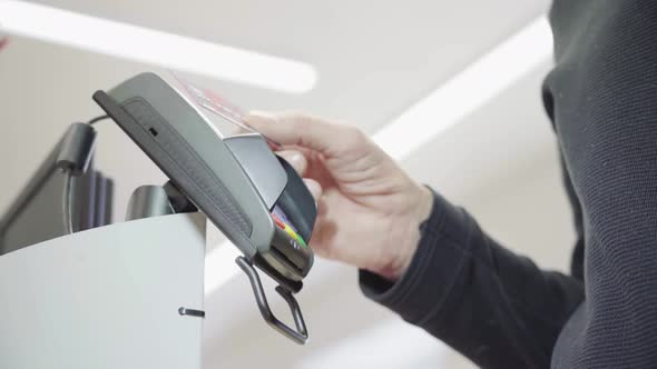 Pay for Goods Through the Terminal in a Contactless Way in a Supermarket