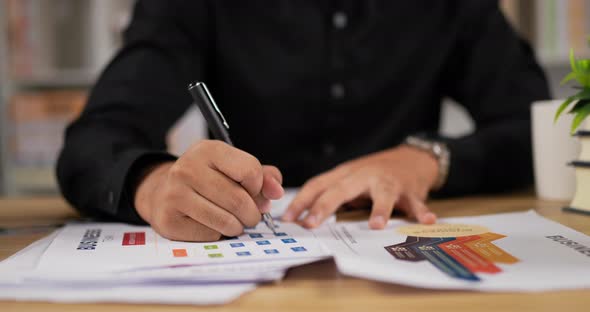 Closeup hand of man writing paperwork