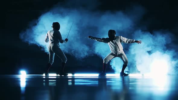 Two Fencers are Attacking Each Other in Slow Motion