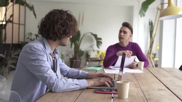 Young Gay Couple Reading Good News in Document Smiling Excited By Mail Letter Checking Paying