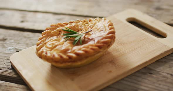 Video of pie seen from above on wooden background